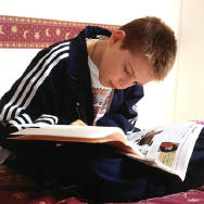 a boy reading the BIble